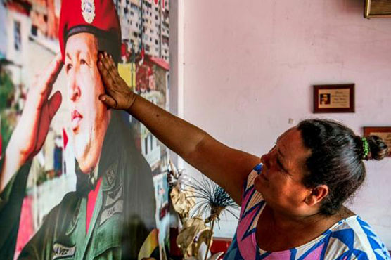 Crisis-hit Venezuela pays tribute to Chavez, two years on