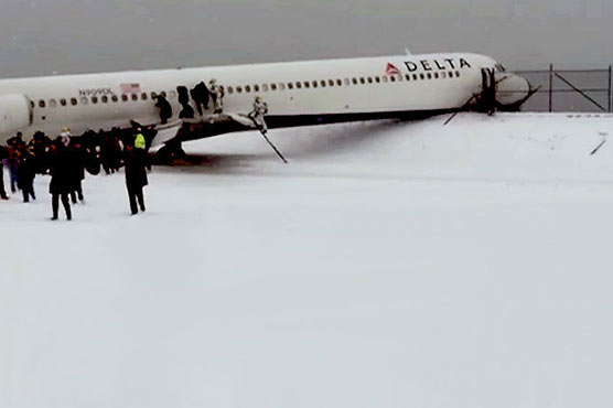 Plane skids off New York runway as winter storm hits US