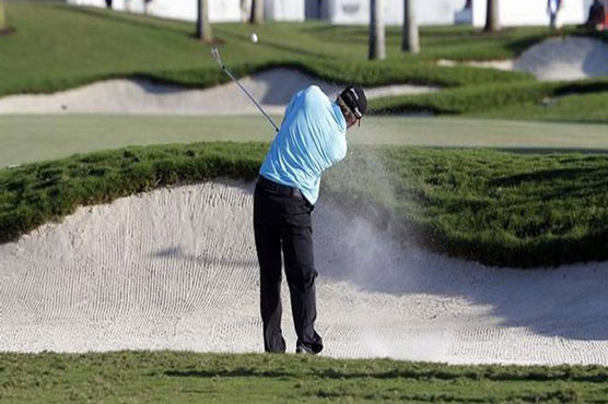 Golf: Holmes grabs Doral WGC lead with ace, birdie run