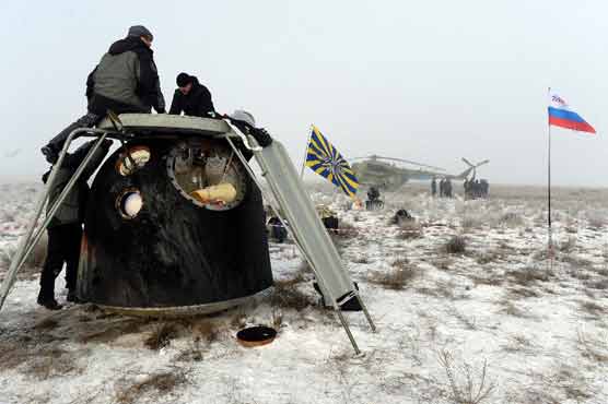 Astronauts return to Earth on Russian Soyuz spaceship