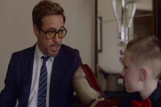 'Iron Man' star Downey presents boy with bionic arm
