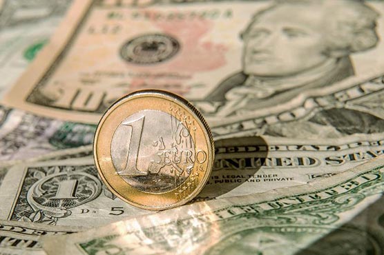 Dollar hits 12-year euro high before Fed meet, Shanghai jumps 
