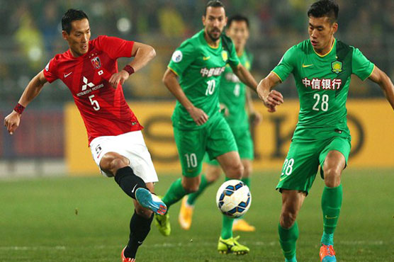 Football: Late double puts Beijing in box seat