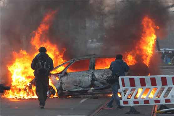 Police car burnt, windows smashed at start of anti-ECB protest