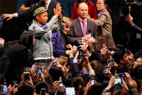 'Happy' Pharrell mobbed at UN General Assembly