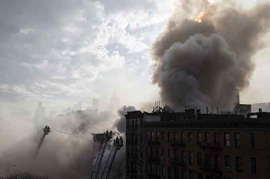 Nineteen hurt as blast, then fire bring down New York buildings