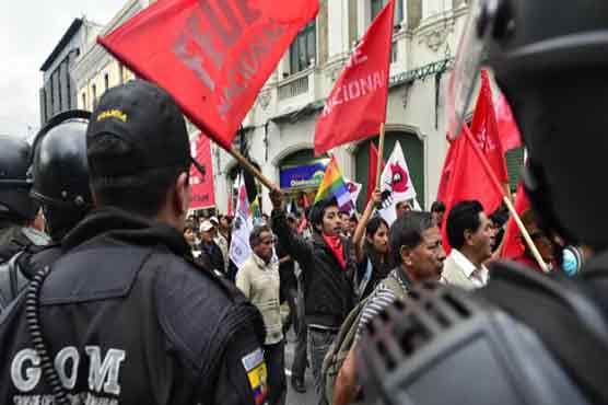 Thousands rally in Ecuador for and against president