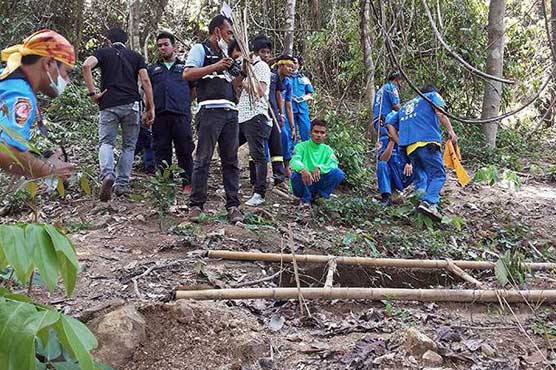 Thai forensics exhume three skeletons from migrant mass grave