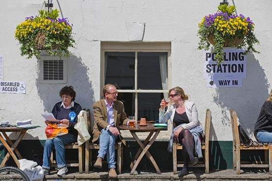 In pubs, schools, uncertain UK election weighs on voters