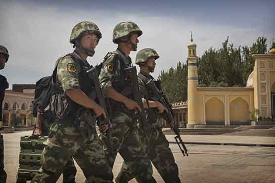 China seeks new wave of migrants for restive Xinjiang