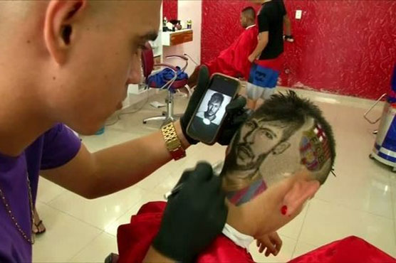 Brazil hairdresser etches stars' faces on heads