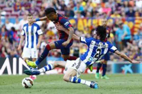 Football: Barcelona on brink of Liga title after Real draw