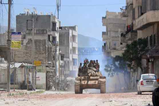Syrian troops battle to free trapped forces: monitor