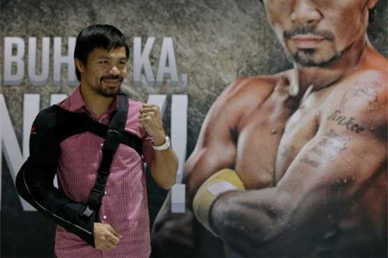 Injured Pacquiao returns to Philippines