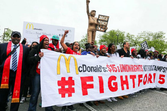 Hundreds march at McDonald's headquarters about low wages