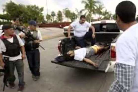 Three bodies found near Mexico city occupied by vigilantes