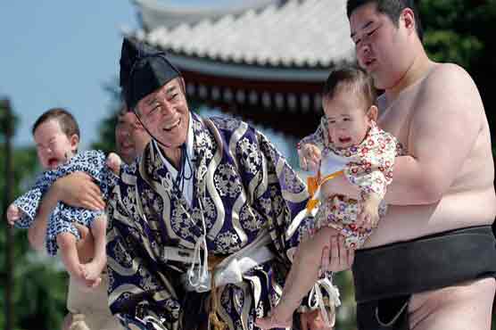 Bawl of a time: Tearful toddlers battle in 'crying sumo'