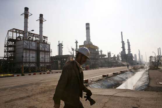 Oil up in Asia but prices under pressure by supply glut