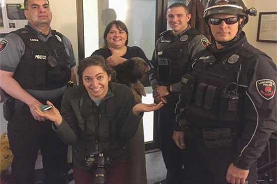 News photographer's tripod mistaken for gun prompts 911 call