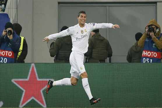 Football: Four-goal Real survive Shakhtar rally to wrap up top spot