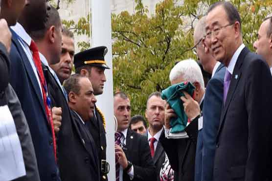 Palestinian flag flies at UN, Abbas seeks full status
