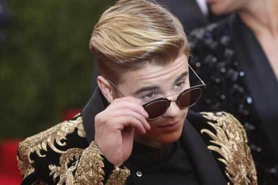 Court upholds charges against photographer who chased Justin Bieber