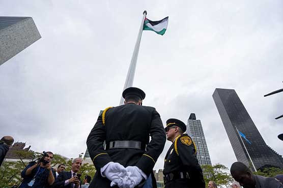 Palestinian flag flies at UN, Abbas seeks full status 