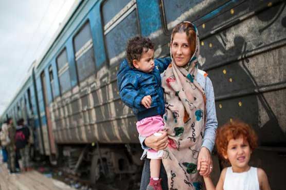 Greece hit by migrant surge as UN approves military action on smugglers