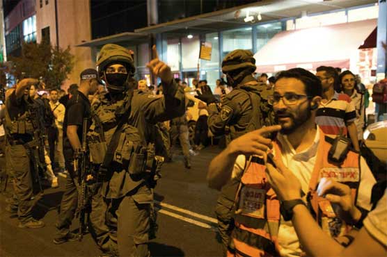 Heavy security, Israelis arm themselves after more knife attacks
