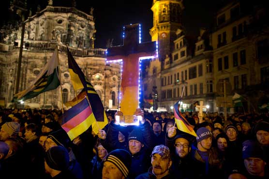 Thousands mass in Dresden for anti-migrant rally, counter-protest