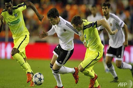 Football: Late own goal edges Valencia past Gent