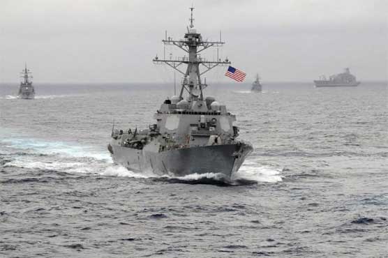 Angry China shadows U.S. warship near man-made islands