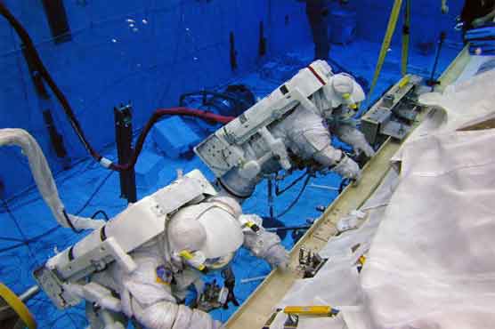 NASA astronauts get workout in marathon spacewalk