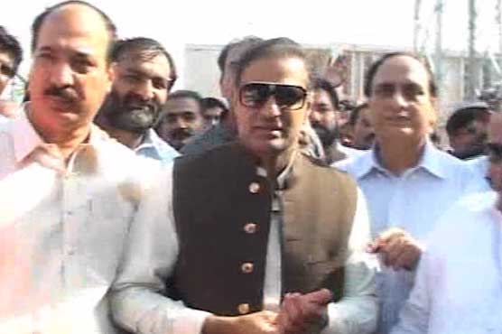 Demonstrators surround Abid Sher Ali's vehicle to protest overbilling