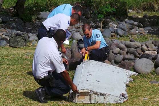 France says wing part found on Reunion island definitely from MH370