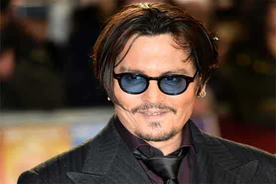 Depp wows Venice in mobster mode