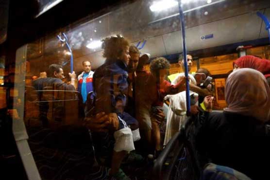 Buses take migrants west to Austria; Hungarian crackdown crumbles