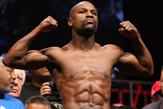 Boxing: Women football coach will be Mayweather's guest at fight