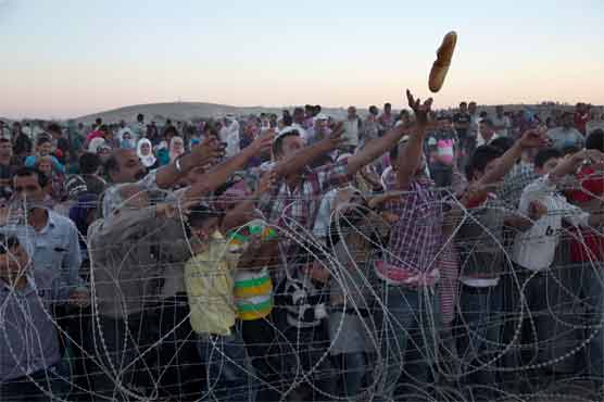 Iran photographer to share prize money with Syria refugees