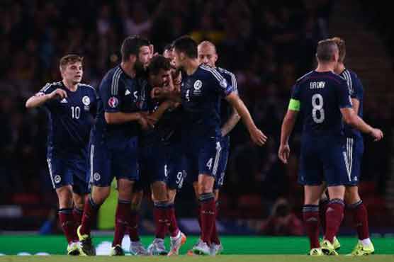 Football: Strachan defiant in defeat by Germany