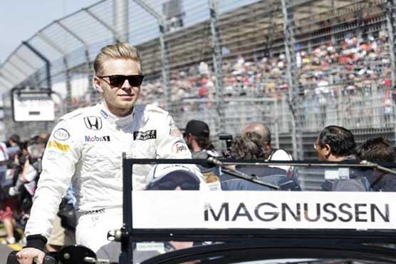McLaren's Magnussen falls off bike and breaks hand