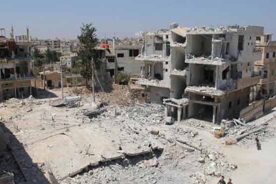 Barrel bombs kill 21 civilians near Syria's Daraa: monitor