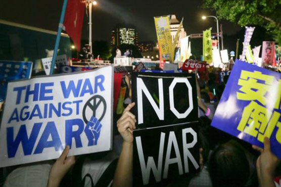 Japan passes controversial security bills into law