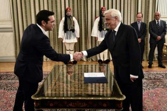 Weary Greeks brace for more economic pain after Tsipras win