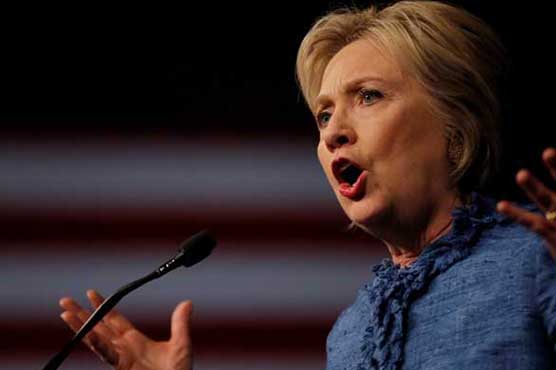 Clinton tells workers she'll stand up to cheating China