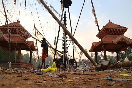 Police say seven connected to India temple surrender after fire