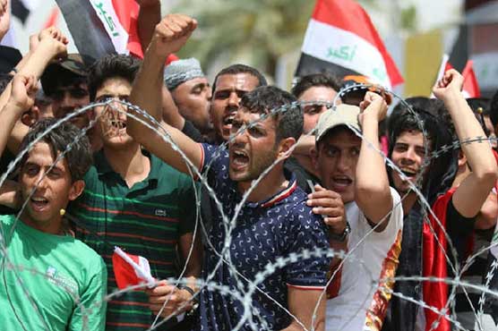 Iraq parliament row impedes cabinet vote as thousands protest