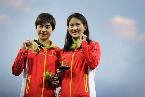 Olympics: China wins 10m synchro dive, Chen ties medal mark