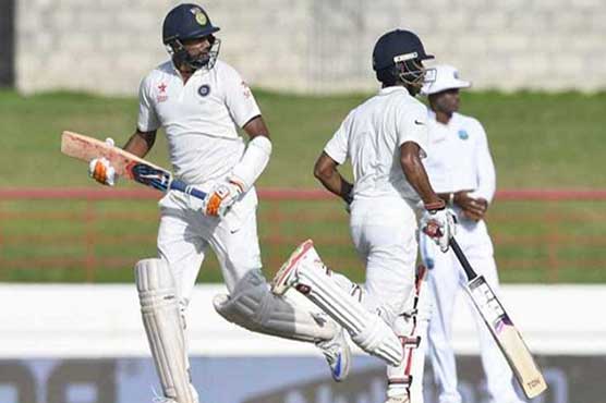 India's Ashwin and Saha dig in to halt Windies