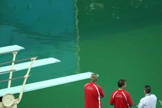 Bright green Olympic pool overshadows events